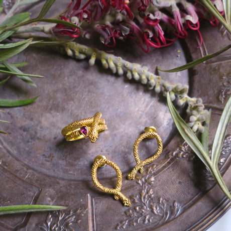 " seekers" snakes piercings/ gold