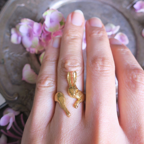Rabbit ring worn on the hand — artisanal jewelry that catches light and adds humor to the fingers.