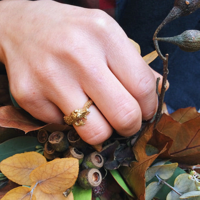 Gold-plated silver crocodile ring worn on a hand — sculptural animal ring handcrafted in Paris, statement jewelry with humorous charm.