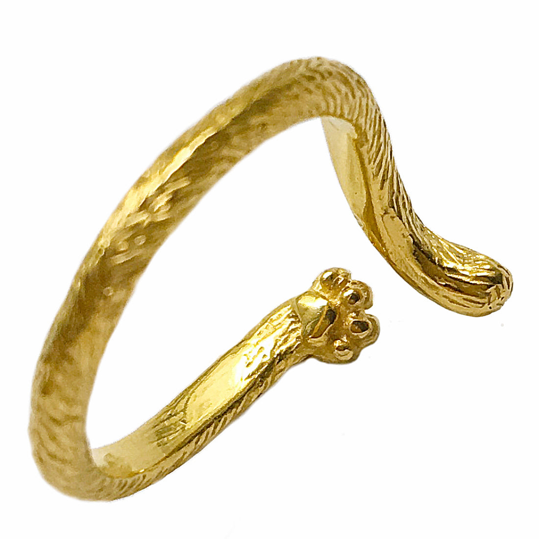 Close-up side view of a cat tail ring in 18K gold-plated silver, showing the sculpted paw pad on the underside and detailed fur texture