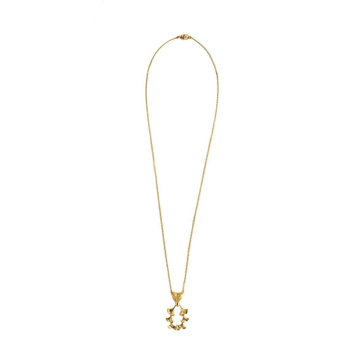 Full-length view of Fox & Ginkgos gold plated necklace with 55 cm chain on plain backdrop