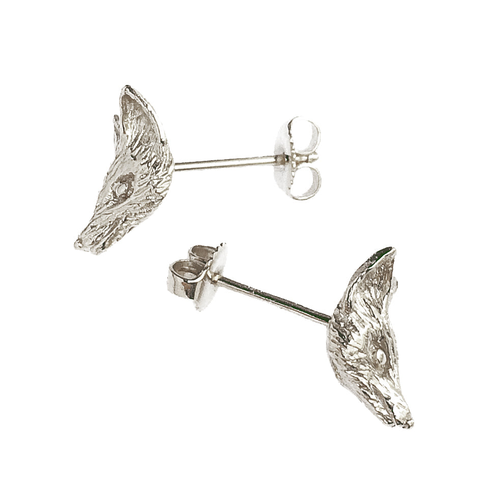 Fox head stud earrings in sterling silver, detailed sculptural design with minimalist animal motif.