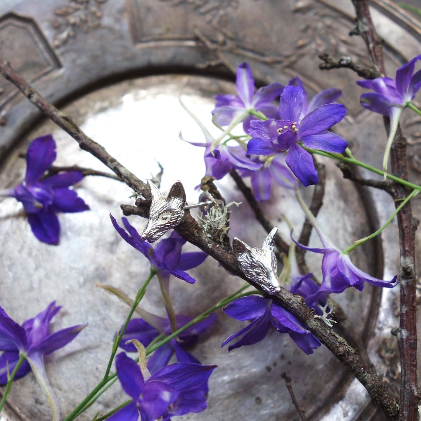 Sculpted fox earrings in sterling silver worn as subtle animal jewelry, inspired by nature and handcrafted in Paris.