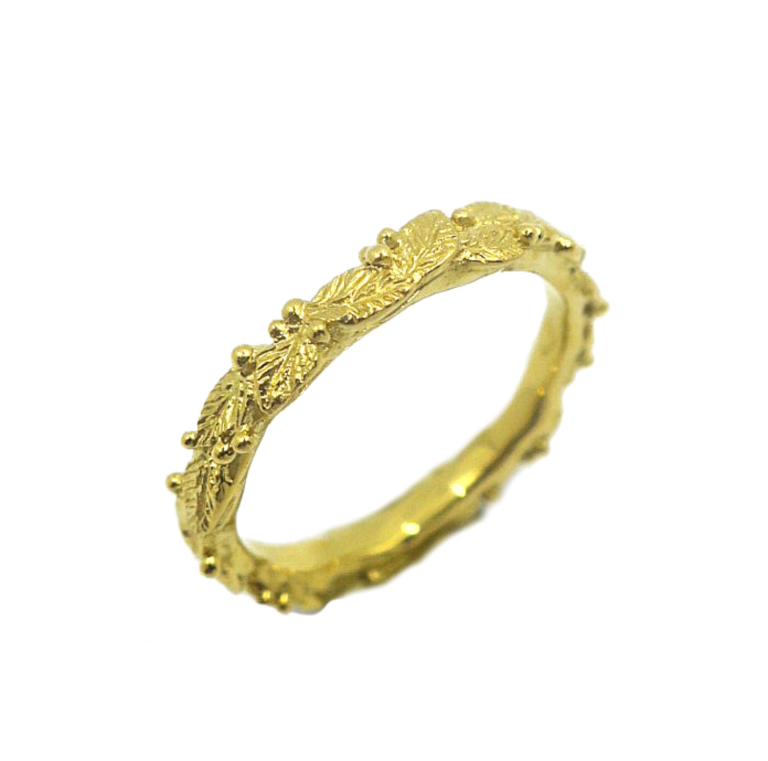 Botanical gold-plated silver ring inspired by leaves and morning dew, hand-sculpted with delicate natural textures — fine botanical jewelry for nature-inspired styles.