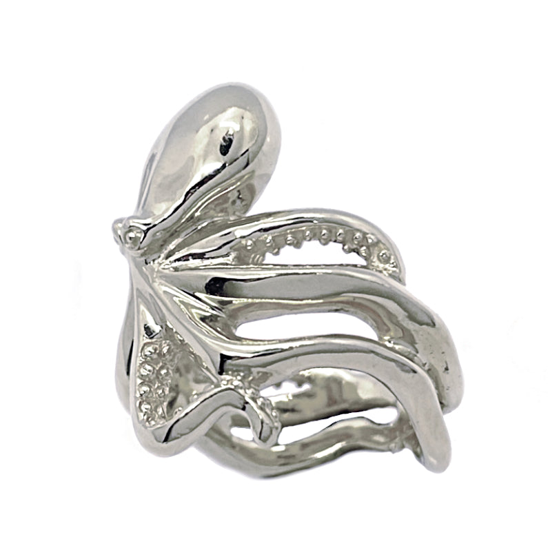 Hand-sculpted solid silver octopus ring showing textured suction cups and organic curves; sea-inspired statement jewelry for marine life lovers.
