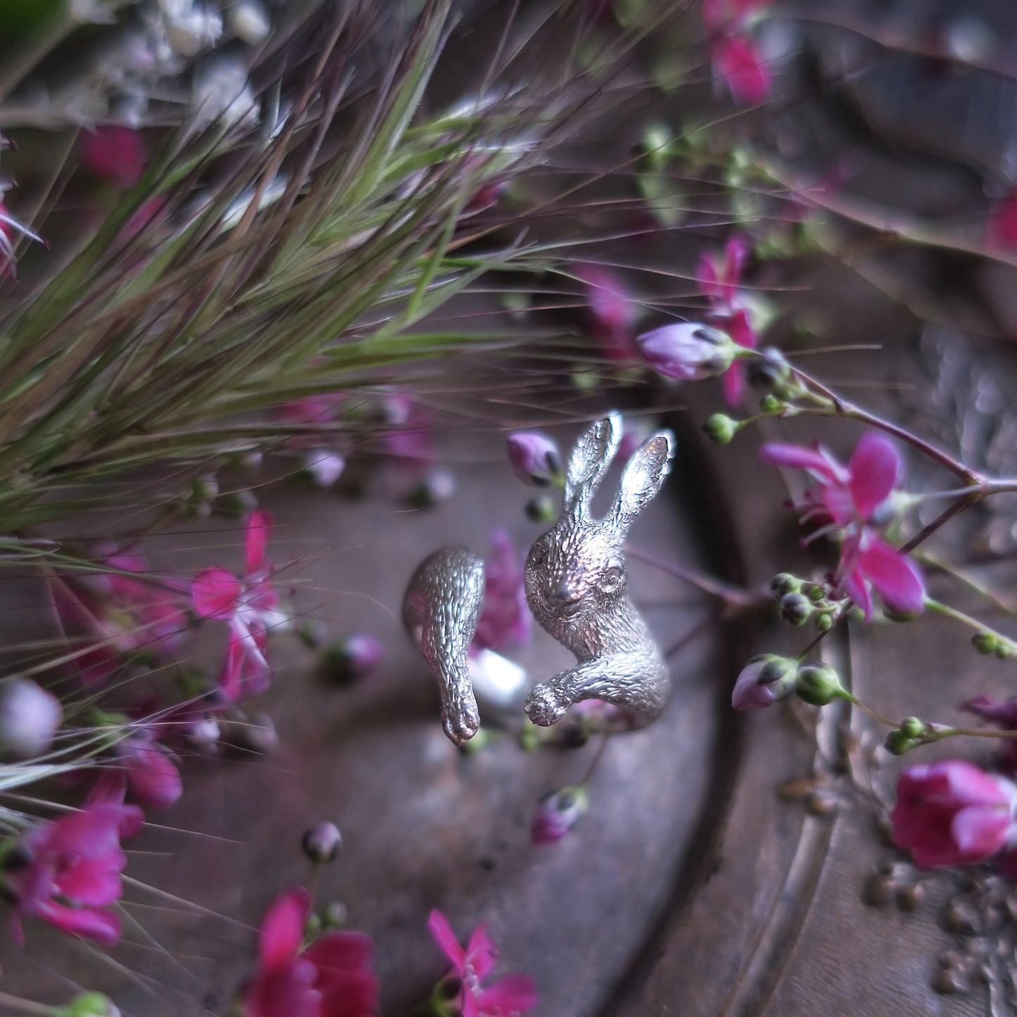 Artistic mood photo of the rabbit ring with flowers — poetic handmade jewelry from Paris by Fusako Koike.