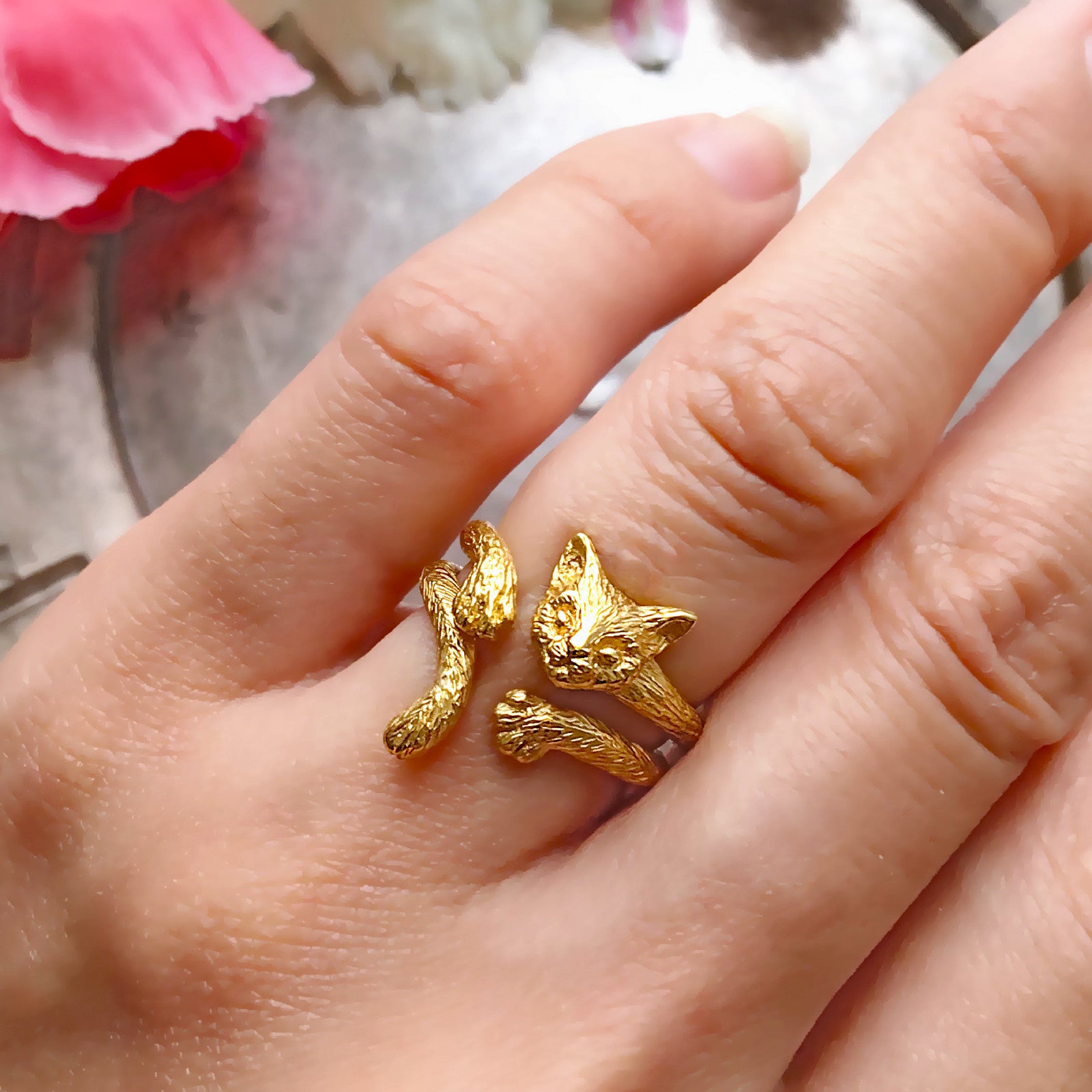 Cat tail and paw ring in 18K gold-plated silver 925 worn stacked with cat face and paw ring, styled with pink flowers
