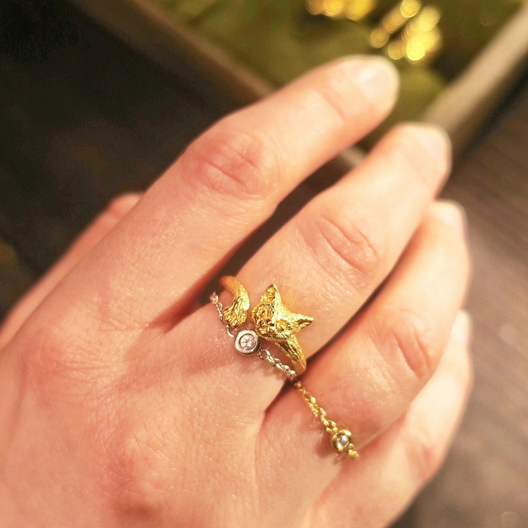 Cat face and paw ring in 18K gold-plated silver 925 worn stacked with diamond chain ring