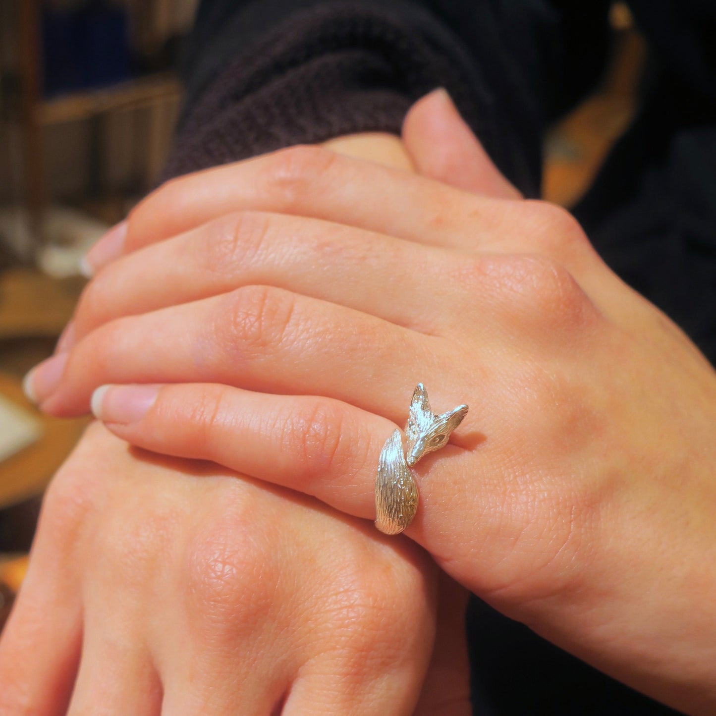 Silver 925 fox pinky ring worn on little finger, sculptural animal ring with detailed fur texture and curved tail design