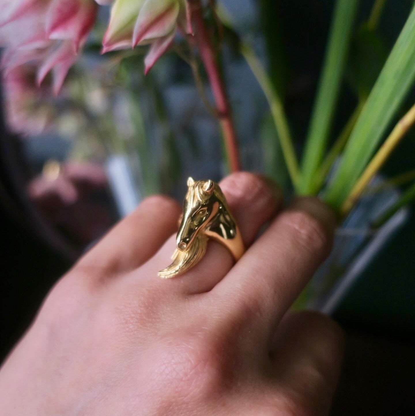 18K gold-plated silver 925 horse ring worn on hand, showing the horse profile and curved tail detail