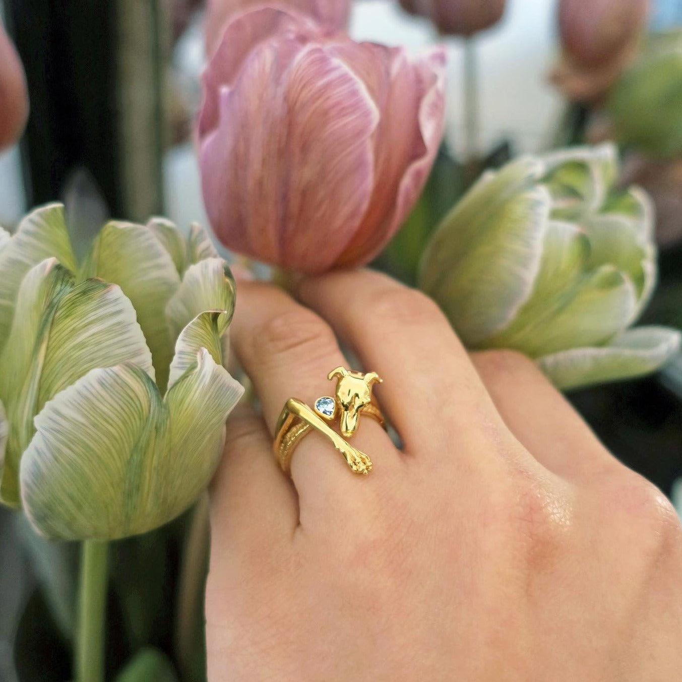 Italian Greyhound ring in 18K gold-plated silver 925 worn stacked with solitaire ring, styled with pink tulips