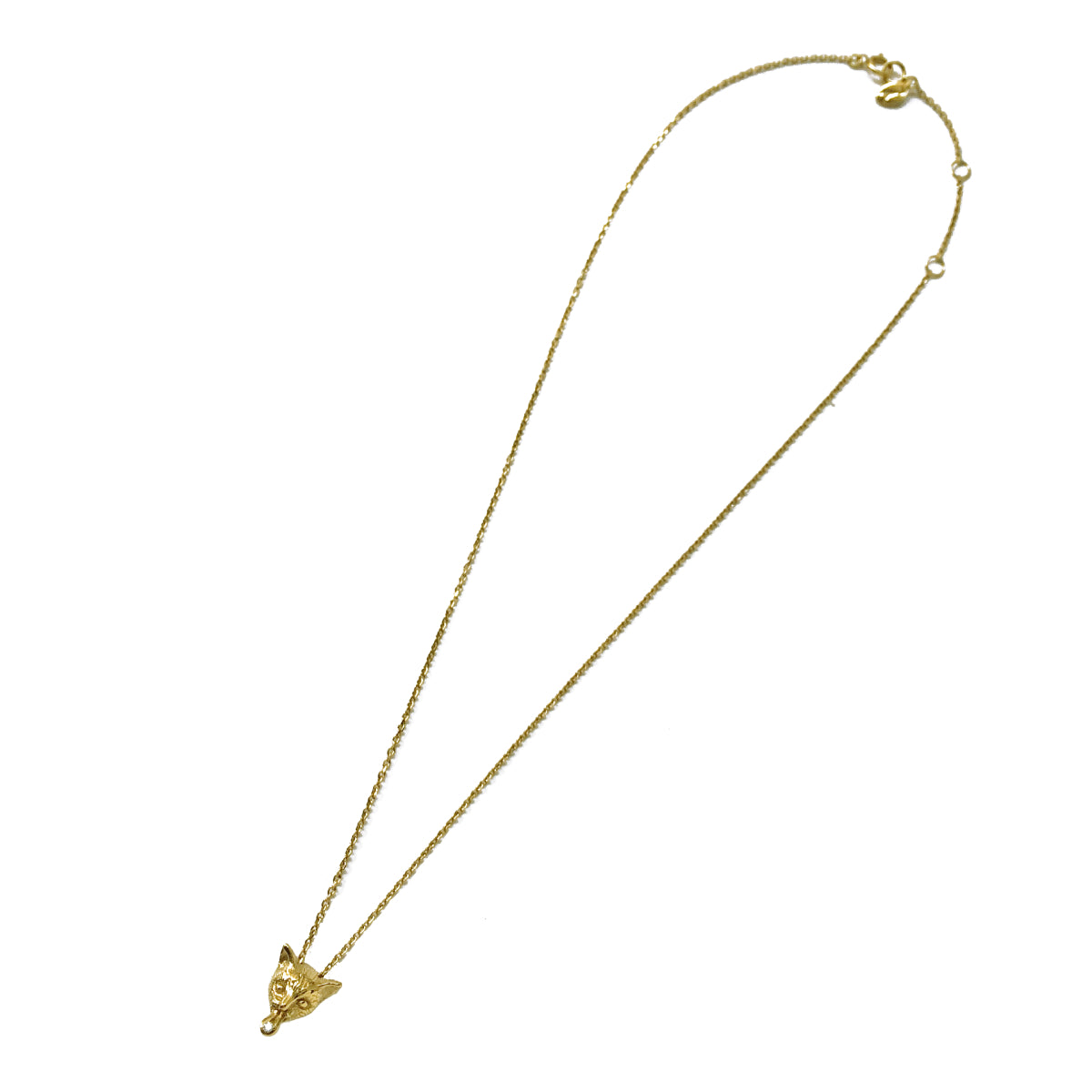 Gold-plated sterling silver cat necklace with an adjustable 42/40/38 cm chain, featuring a mischievous tongue and a white sapphire detail. Paris artisan cat jewelry photographed full length.