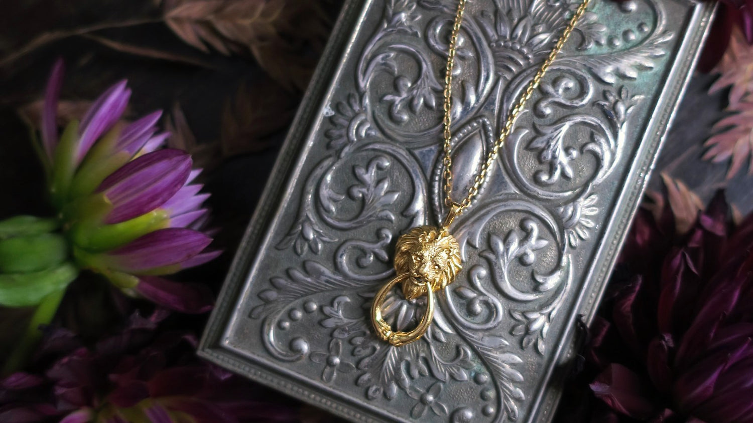 Hand-sculpted lion necklace inspired by an antique door knocker — gold-plated silver pendant with detailed mane and textured finish, artisanal animal jewelry made in Paris