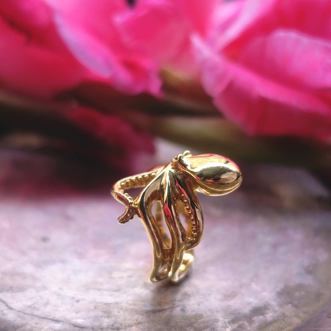 Octopus ring in gold plated sterling silver on metal plate