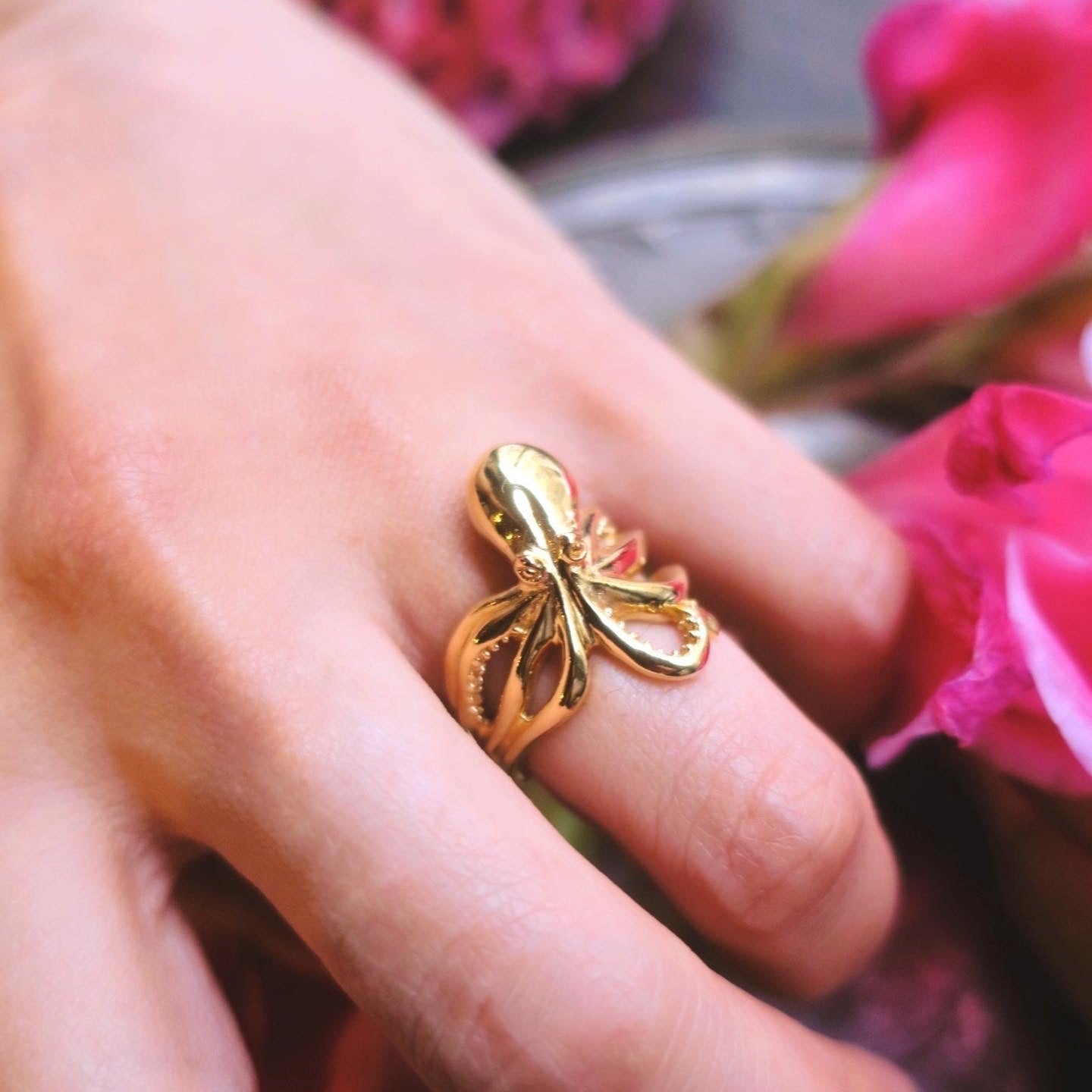 Octopus ring in gold plated sterling silver worn on finger wrapping design