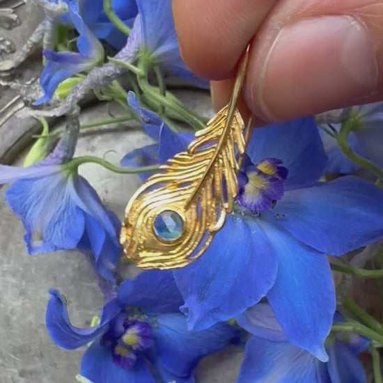 video showing peacock feather earring