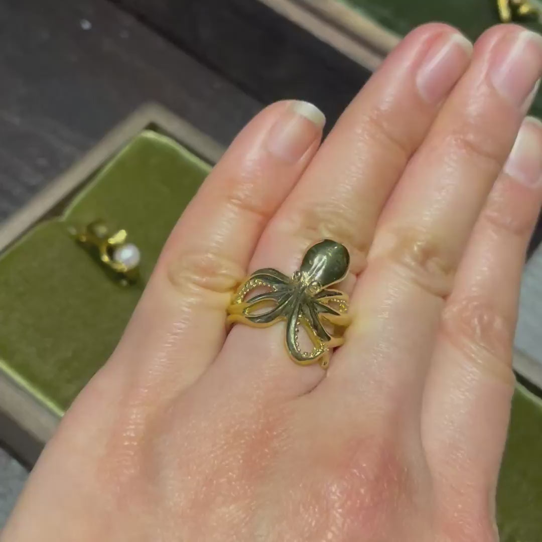 Octopus ring in gold plated silver worn on finger rotating front and palm side video