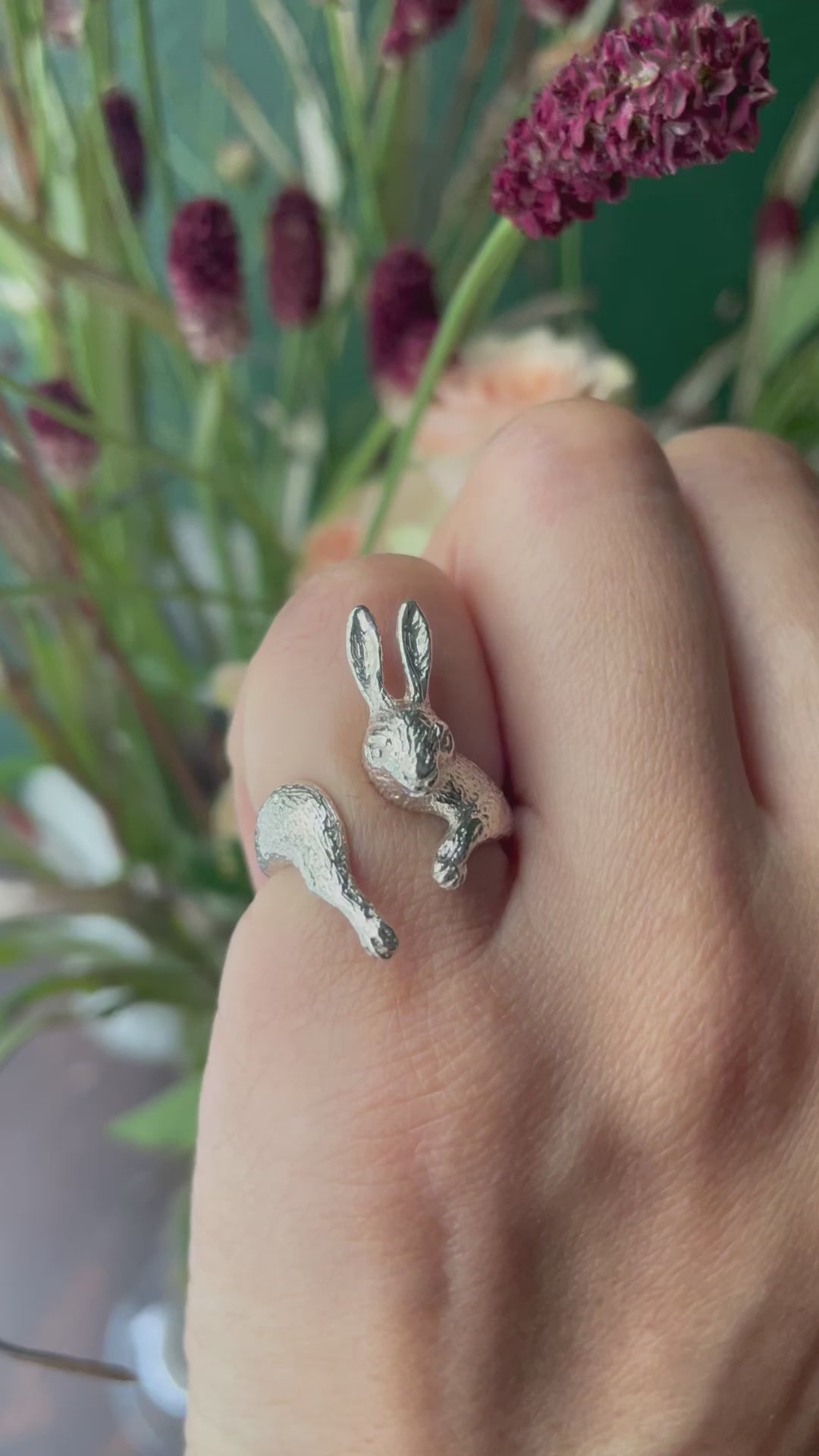 Video showing the rabbit ring worn on the hand,reflecting light and movement — highlighting sculptural beauty.