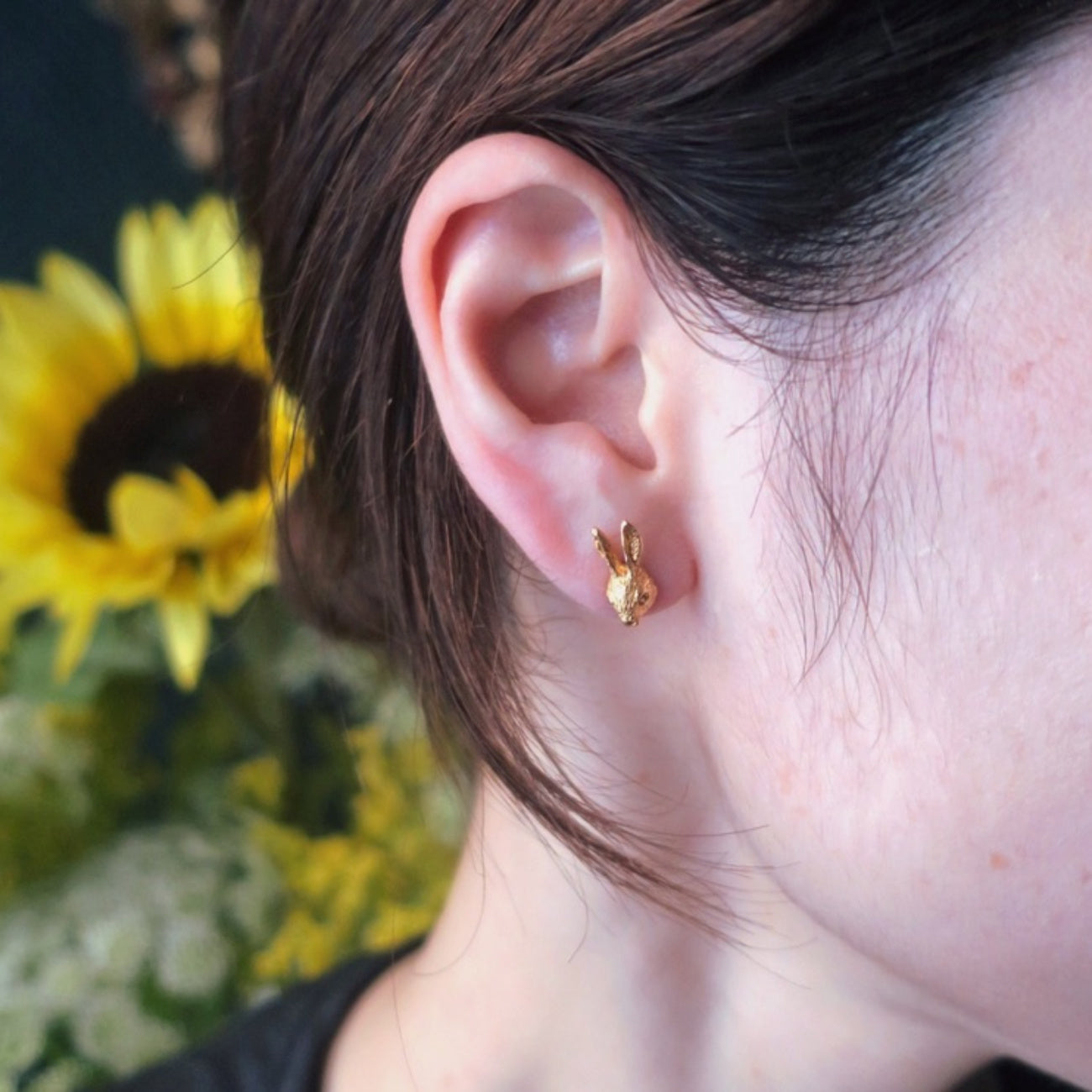 Rabbit head earring in gold plated sterling silver worn on ear