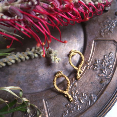 " seekers" snakes piercings/ gold