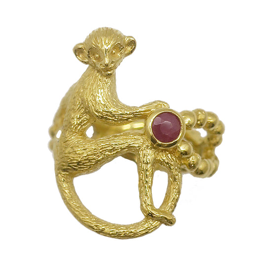 Gold-plated silver monkey ring holding a pearl and rough-cut ruby necklace — handmade in Paris by Fusako Koike