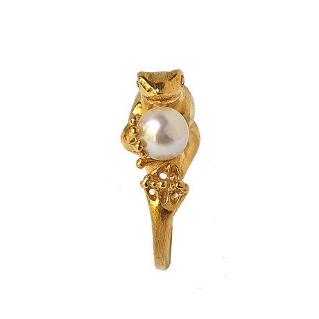 Gold-plated silver frog ring with a freshwater pearl photographed with red and white flowers, poetic Art Nouveau animal jewelry.